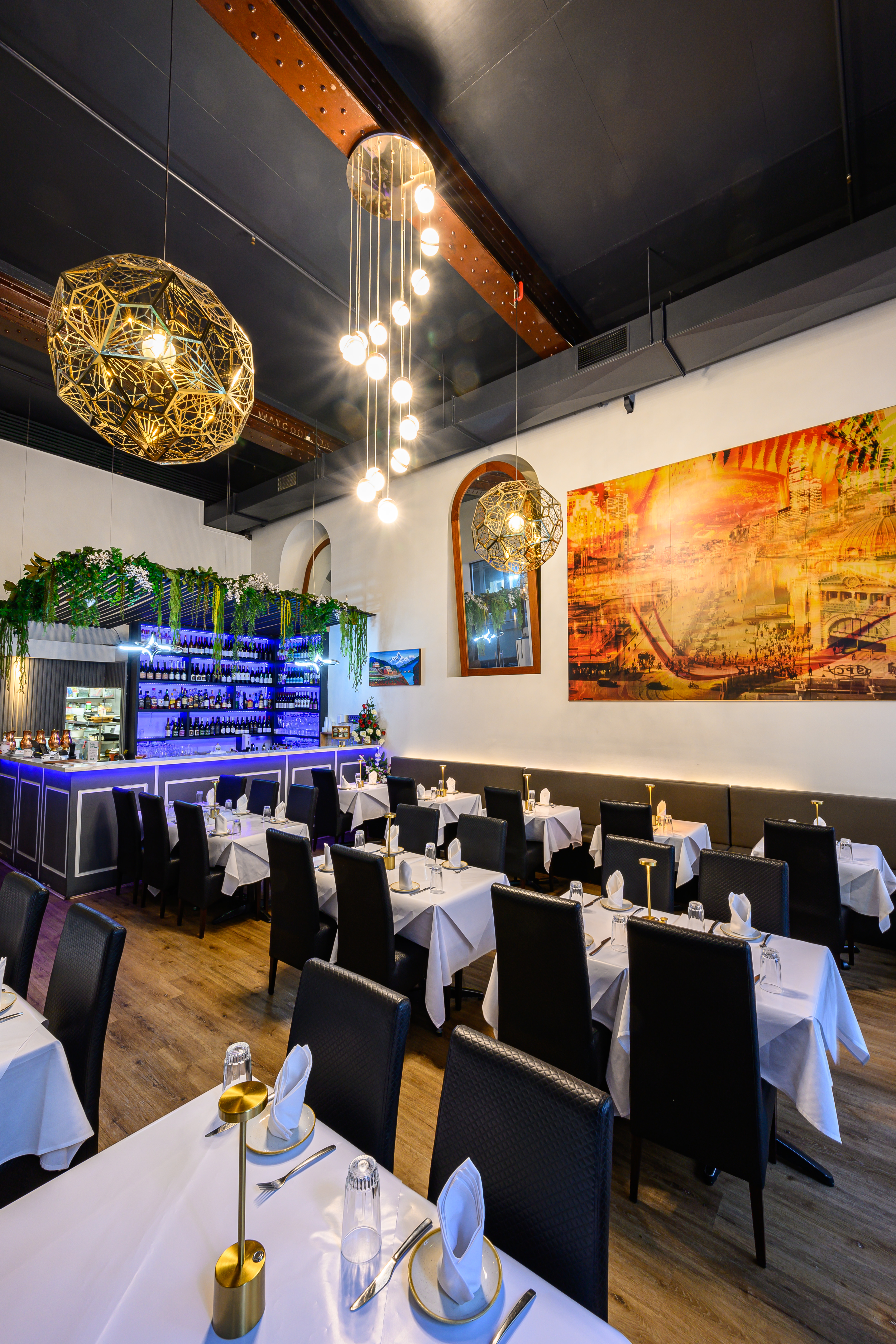 Aagaman Melbourne CBD — white linen tables and lantern lighting