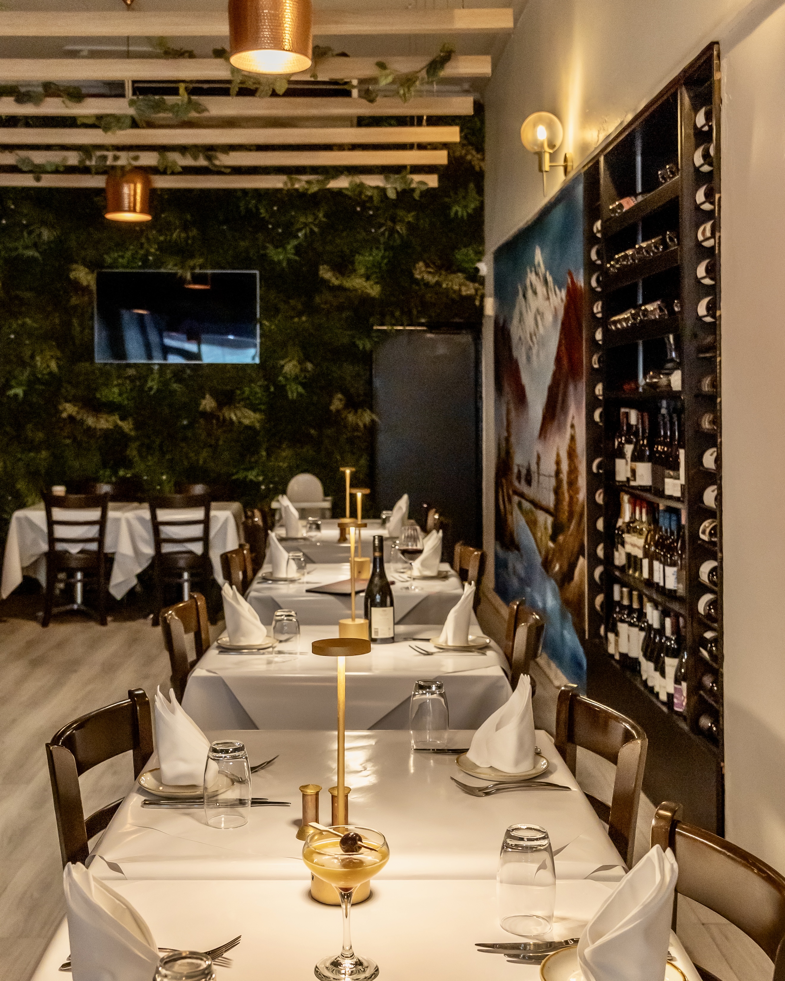 Aagaman Port Melbourne — dining room set for service